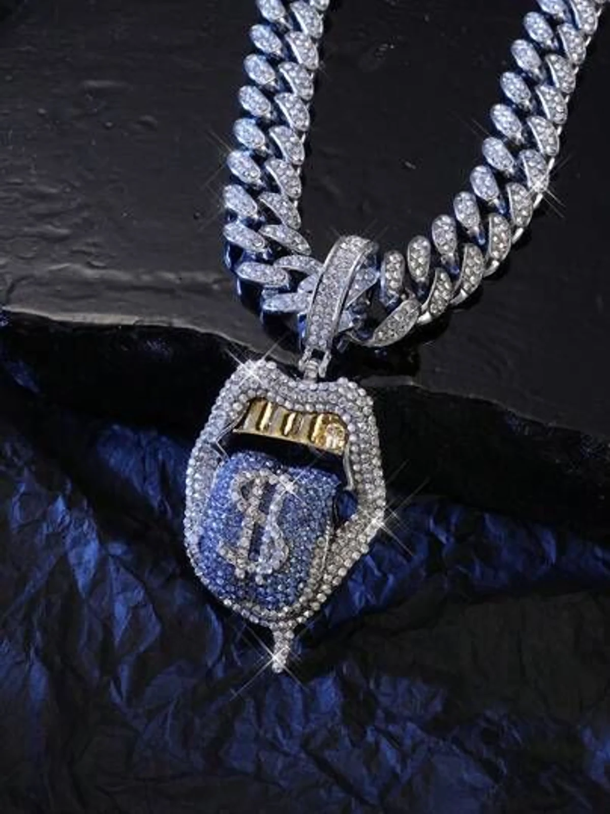 Diamond pendant on an iced-out Cuban link chain