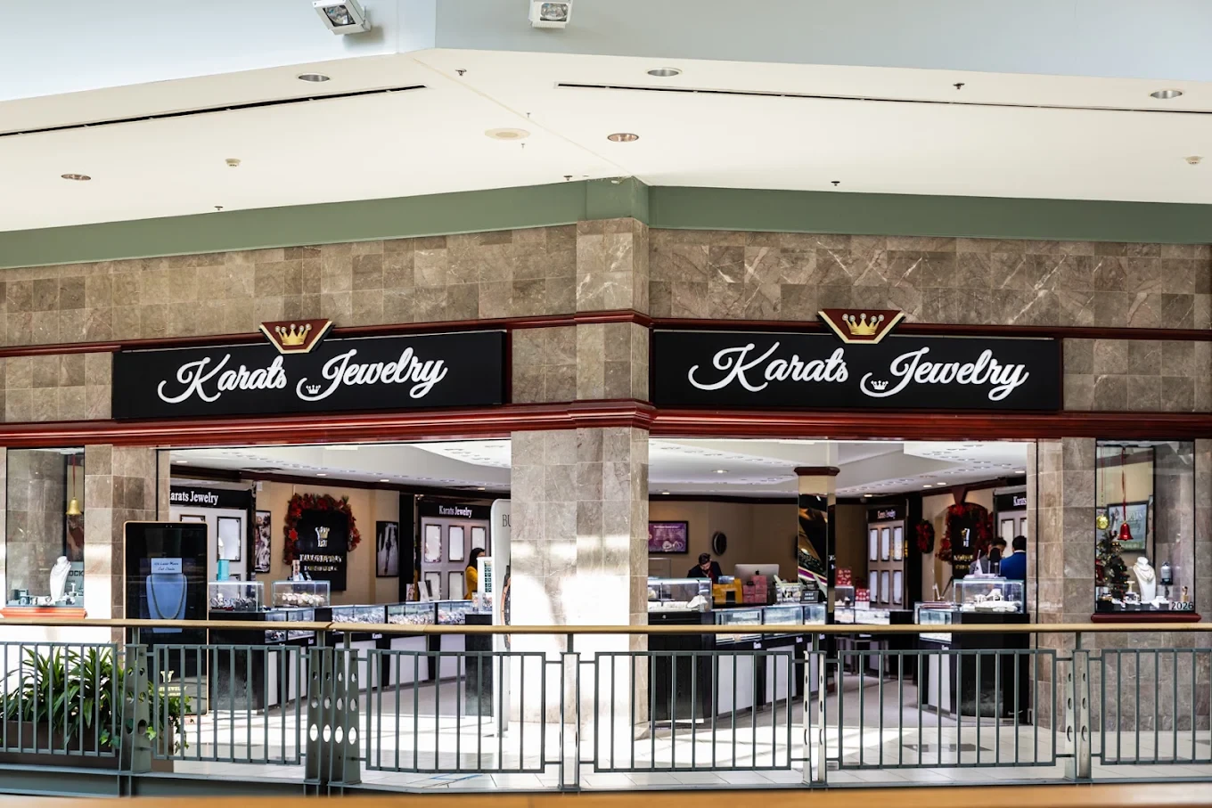 Karats Jewelry storefront with glass display counters and lit jewelry cases